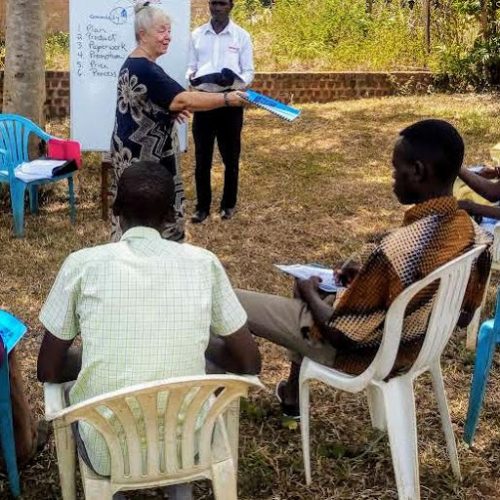 Handing-out-workbooks-1 Handing-out-workbooks-1